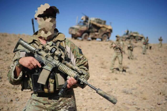 SASR operator standing guard and brandishing his assault rifle