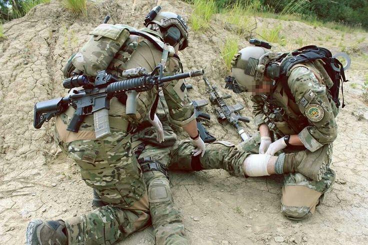 US Air Force Pararescue Jumpers (PJs) stabilizing the wounded in the field