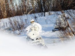 Member of the Finmark 7th Jager Company on snowmobile