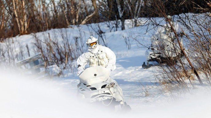 Member of the Finmark 7th Jager Company on snowmobile