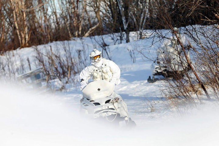 Member of the Finmark 7th Jager Company on snowmobile