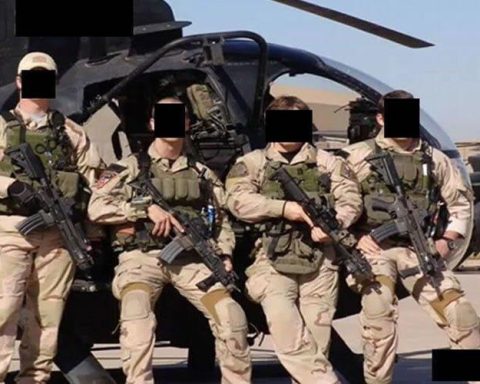 Special Operations Forces from JSOC at undisclosed location posing in front of helicopter