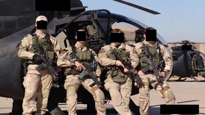 Special Operations Forces from JSOC at undisclosed location posing in front of helicopter