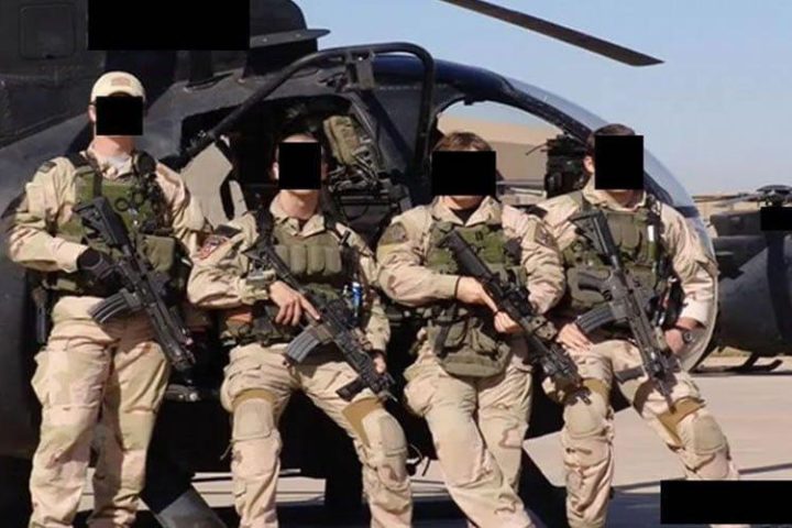 Special Operations Forces from JSOC at undisclosed location posing in front of helicopter