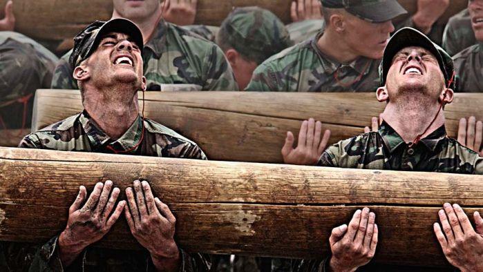 Navy SEAL Salary: Navy SEALs during the BUD/s with a wood