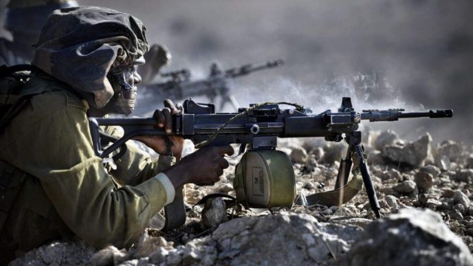 IDF infantry soldier firing from IWI Negev light machine gun