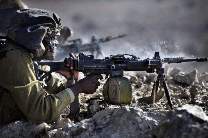 IDF infantry soldier firing from IWI Negev light machine gun