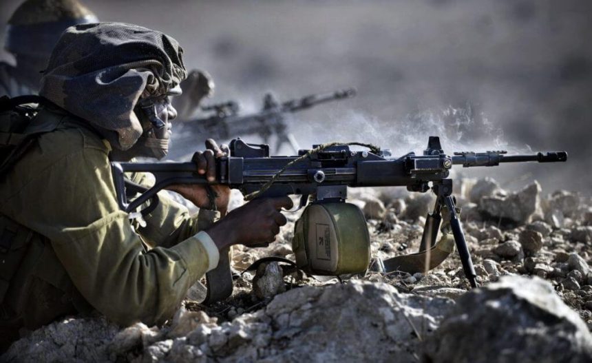 IDF infantry soldier firing from IWI Negev light machine gun