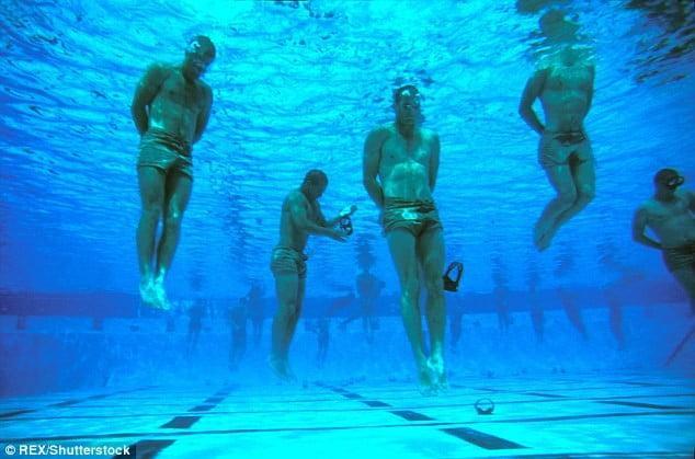 Navy SEALs during BUD/s training in the pool