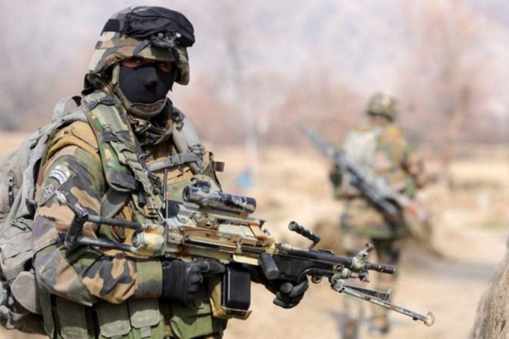 Legionnaire of French Foreign Legion brandishing his FN Minimi machine gun