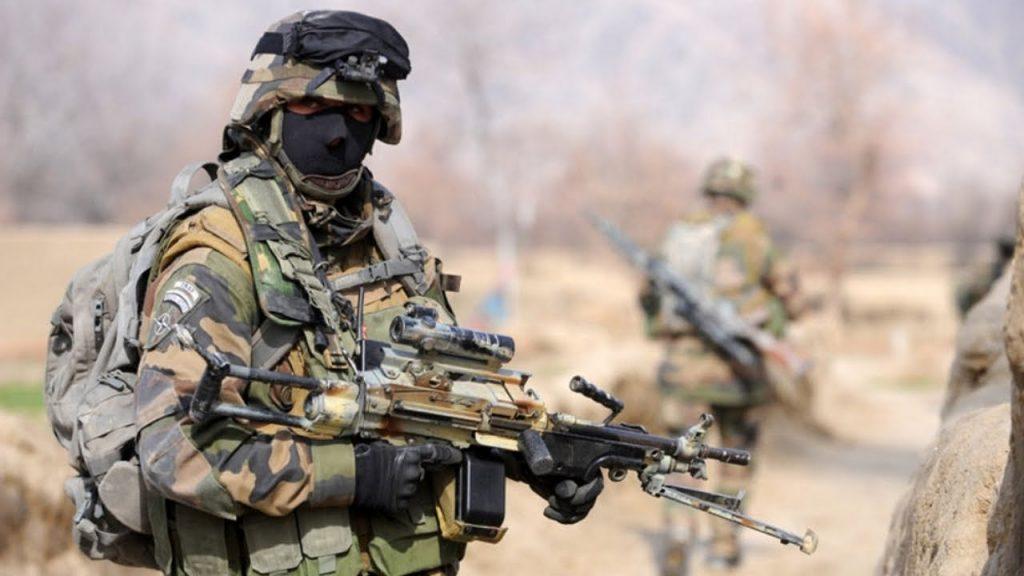 Legionnaire of French Foreign Legion brandishing his FN Minimi machine gun