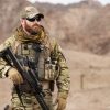 SOF Operator dressed in combat uniform with a beard