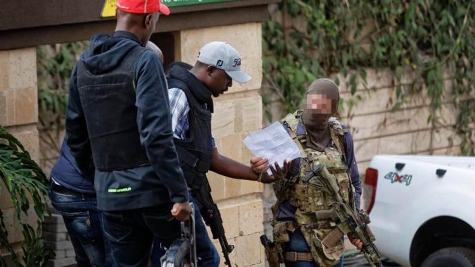 SAS operator is seen speaking with another armed rescuer during hostage crisis in Kenya