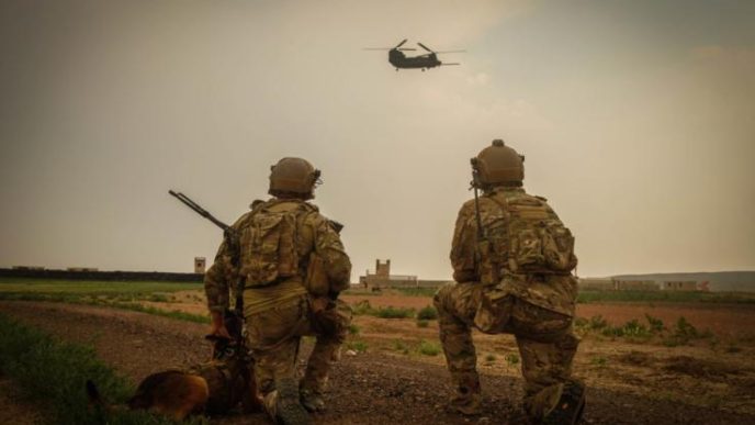 US Army Special Forces operators are observing landing of the chopper