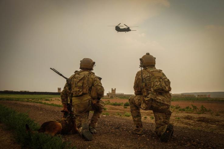 US Army Special Forces operators are observing landing of the chopper