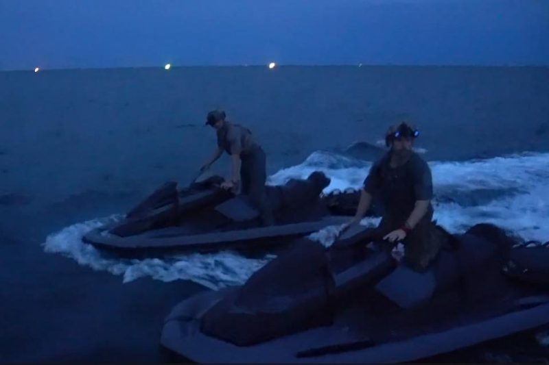 U.S. Navy SEALs on Jet Skis at undisclosed location night