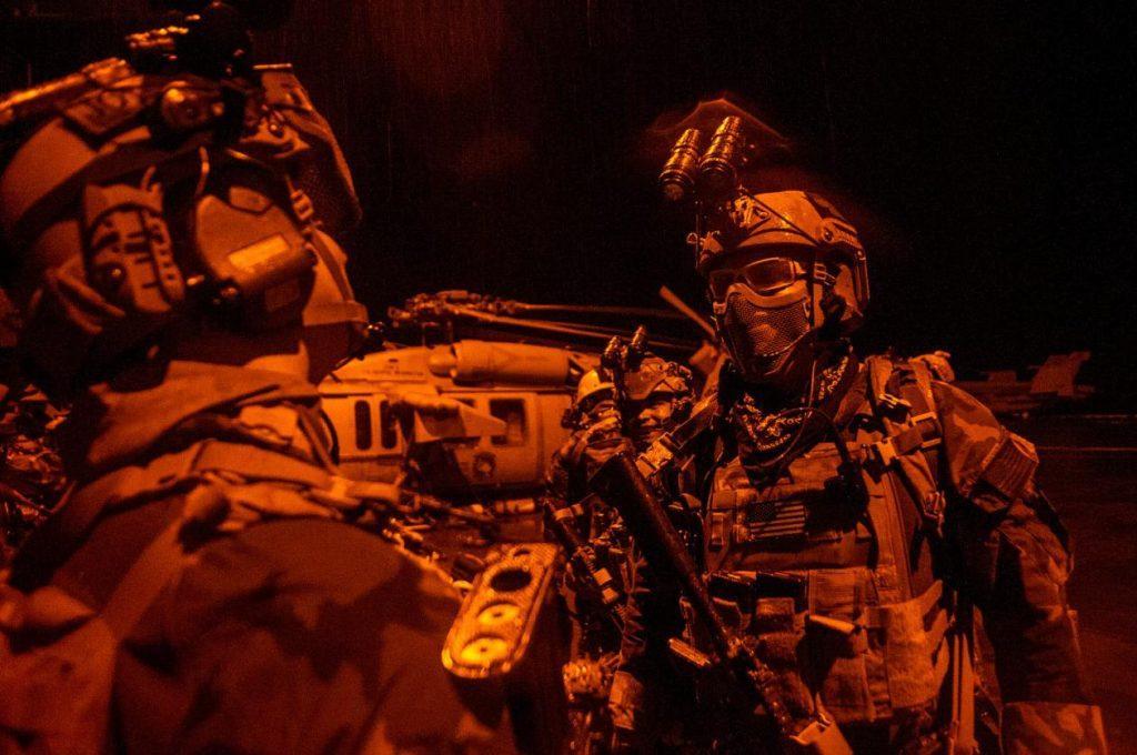 Why do SOF operators wear their wristwatches face inwards?