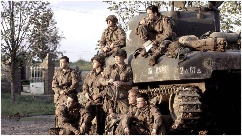 Members of the 101st Airborne sitting on the tank Band of Brothers TV Show 2001