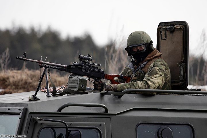 Russian police officer with a PK machine gun