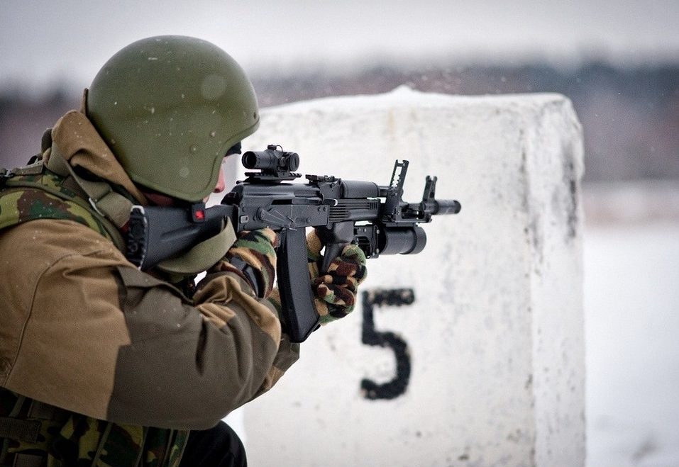 Russian soldier takes aim with his AK-74M