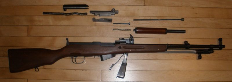 A field-stripped SKS carbine - disassembled into major components for cleaning