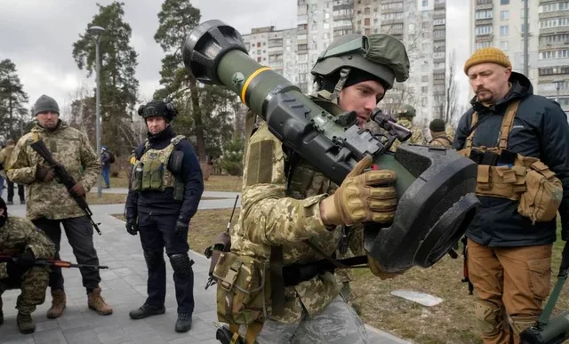 A Ukrainian Territorial Defence Forces member holds an NLAW anti-tank weapon, in the outskirts of Kyiv, Ukraine, on March 9, 2022