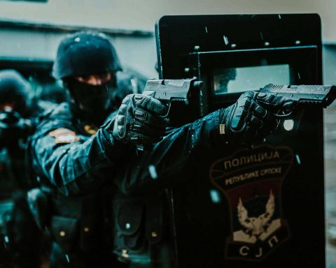 Operators from SAJ aiming with RS9 Vampir while taking cover behind the tactical shield