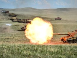 Row of Challenger 2 on a firing range at BATUS, Canada