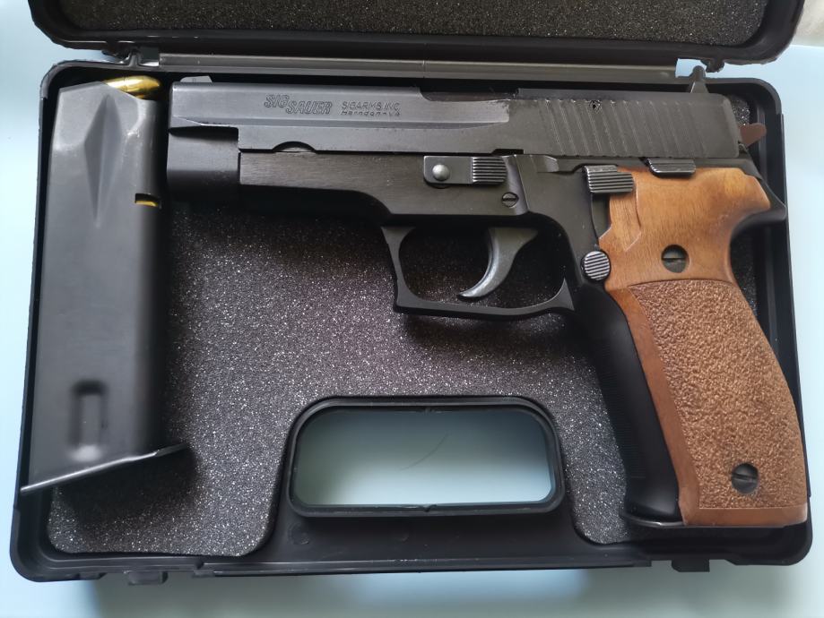 SIG Sauer P226 in the box, with one magazine