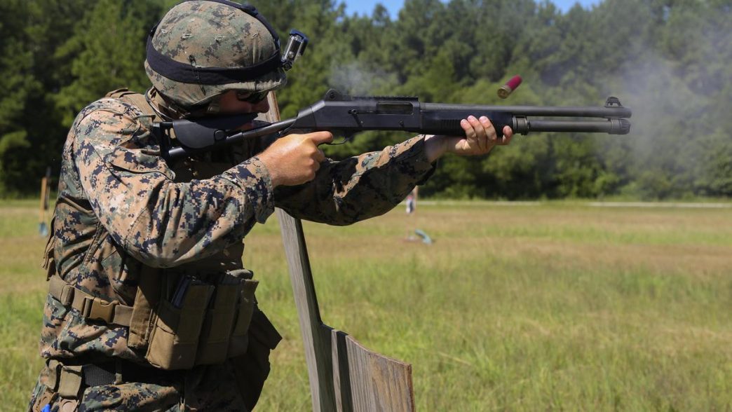 Soldier fires Benelli M4 tactical shotgun