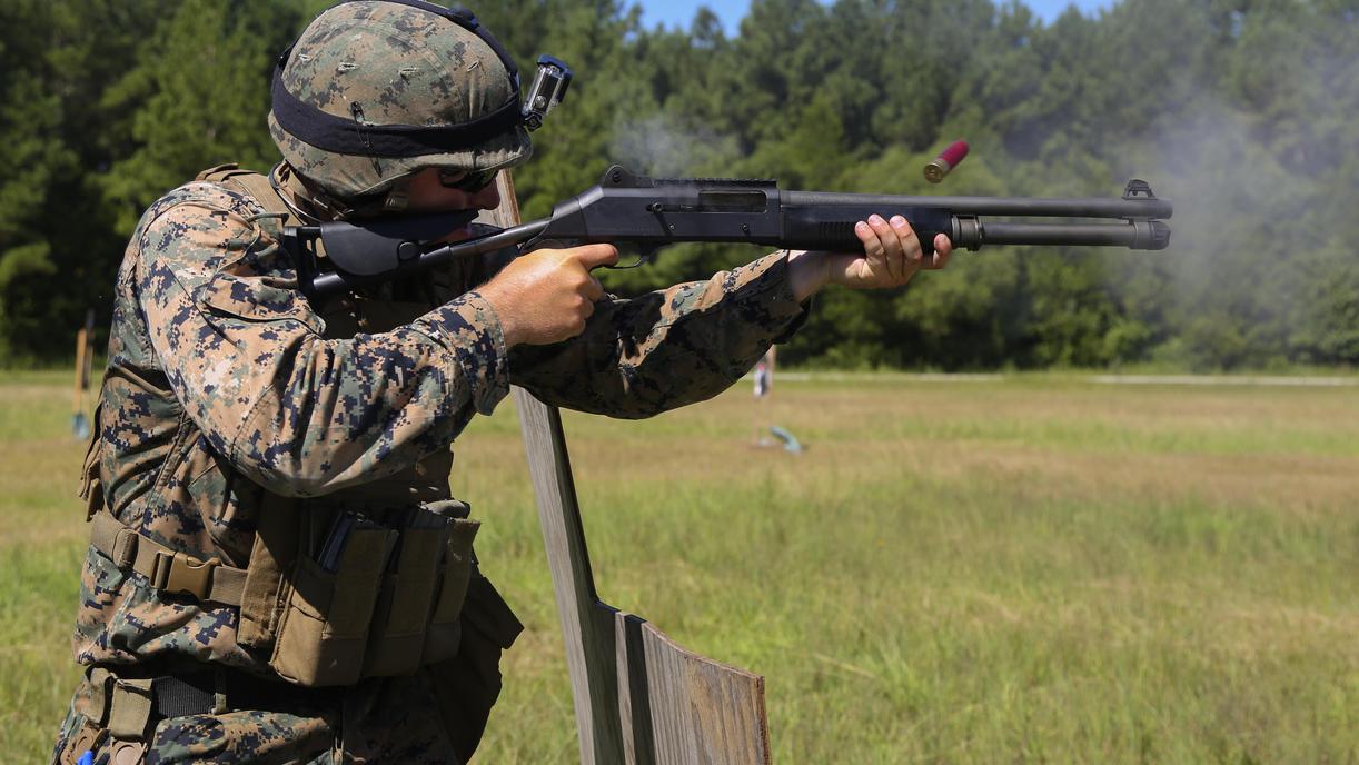 Soldier fires Benelli M4 tactical shotgun