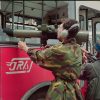 Bosnian soldiers aiming with M79 Osa through the broken window of the bus