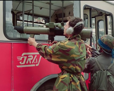 Bosnian soldiers aiming with M79 Osa through the broken window of the bus