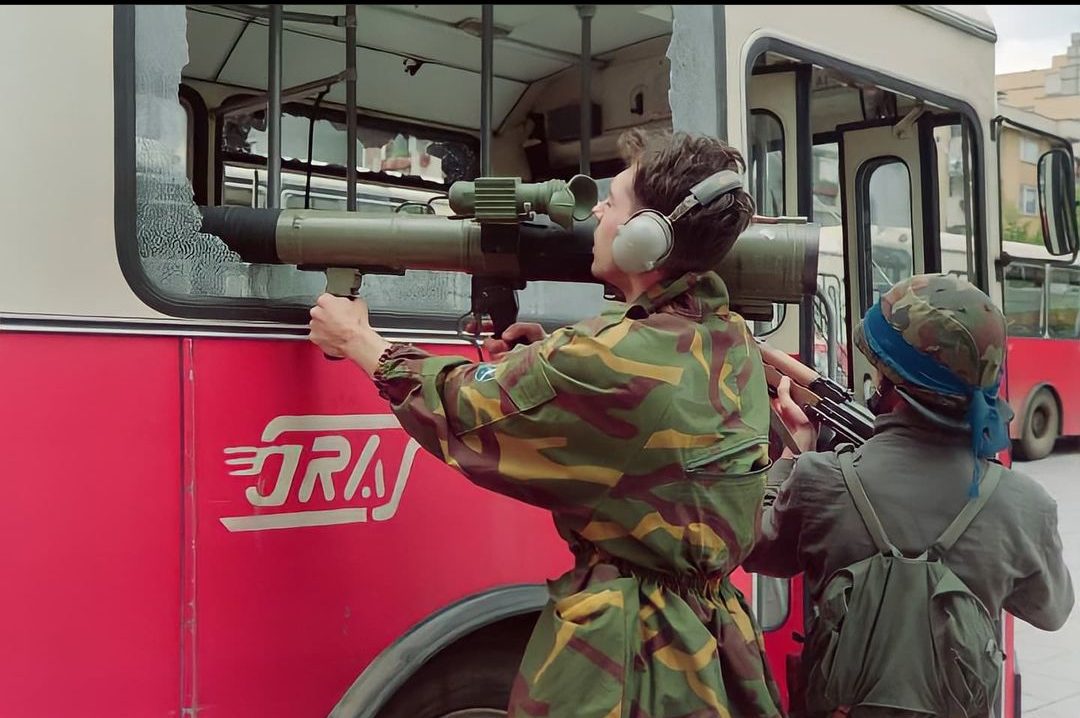 Bosnian soldiers aiming with M79 Osa through the broken window of the bus