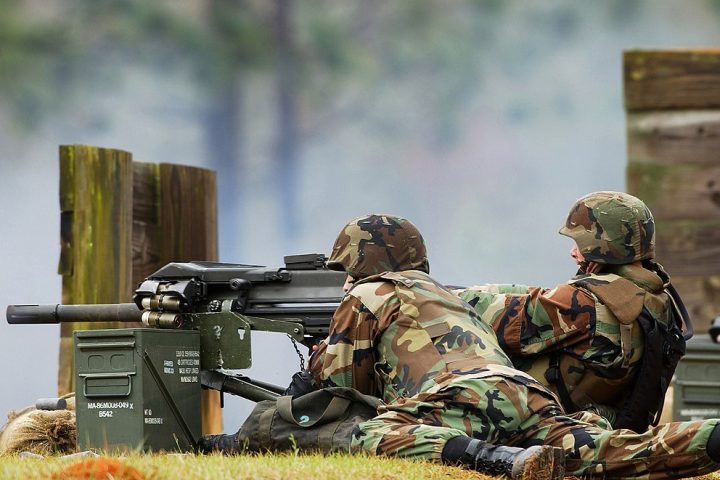 US Navy sailors fire a Mk 19 40 mm grenade launcher during a training exercise in March 2003