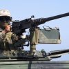 A marine prepares to fire from M2 Browning machine gun