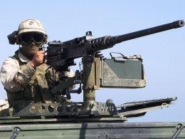 A marine prepares to fire from M2 Browning machine gun