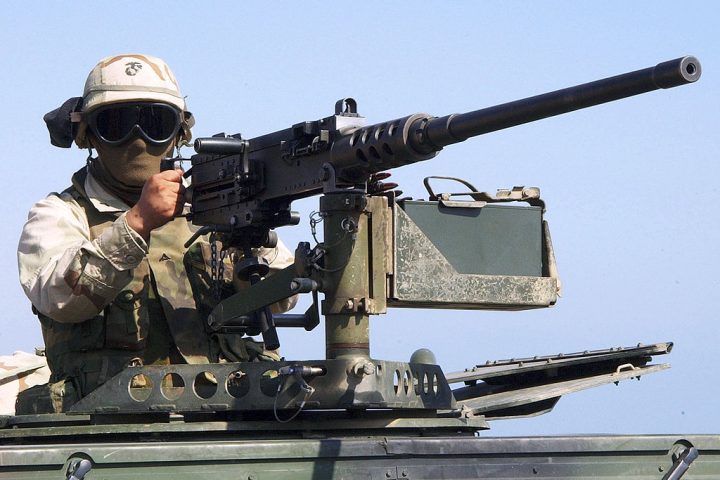 A marine prepares to fire from M2 Browning machine gun