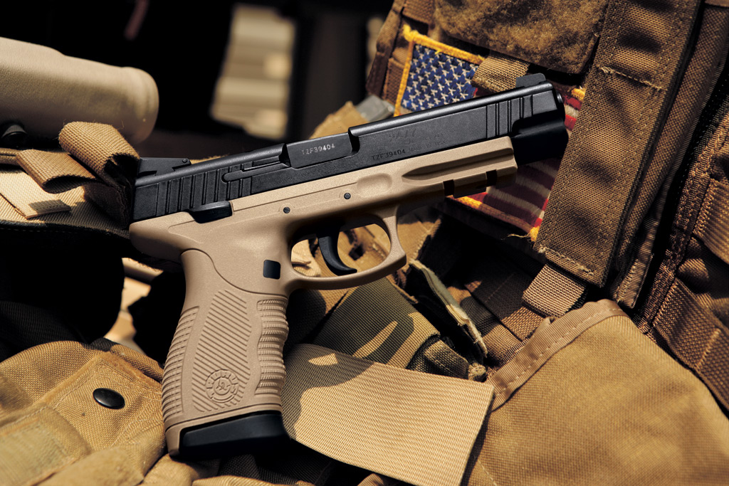 Taurus PT 24/7 OSS DS with American Flag in background