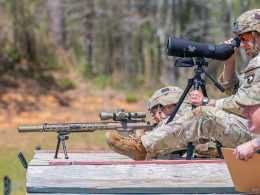 1st Lt. Aaron Arturi (front) and 1st Lt. John Ryan from the 101st Airborne Division (Air Assault), takes aim at stress shoot event at the Annual Best Ranger Competition in Fort Benning, Ga on April 9th, 2022. Ryan is aiming down range at the targets while Arturi is spotting him. The spotter helps the sniper stay on track so they can hit their target