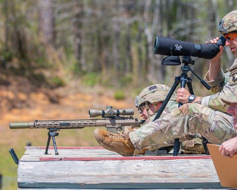 1st Lt. Aaron Arturi (front) and 1st Lt. John Ryan from the 101st Airborne Division (Air Assault), takes aim at stress shoot event at the Annual Best Ranger Competition in Fort Benning, Ga on April 9th, 2022. Ryan is aiming down range at the targets while Arturi is spotting him. The spotter helps the sniper stay on track so they can hit their target