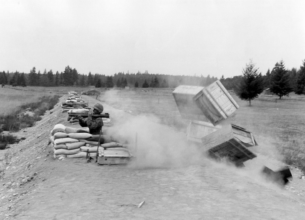 Packing crates are used to demonstrate the danger of the M72 LAW's back blast