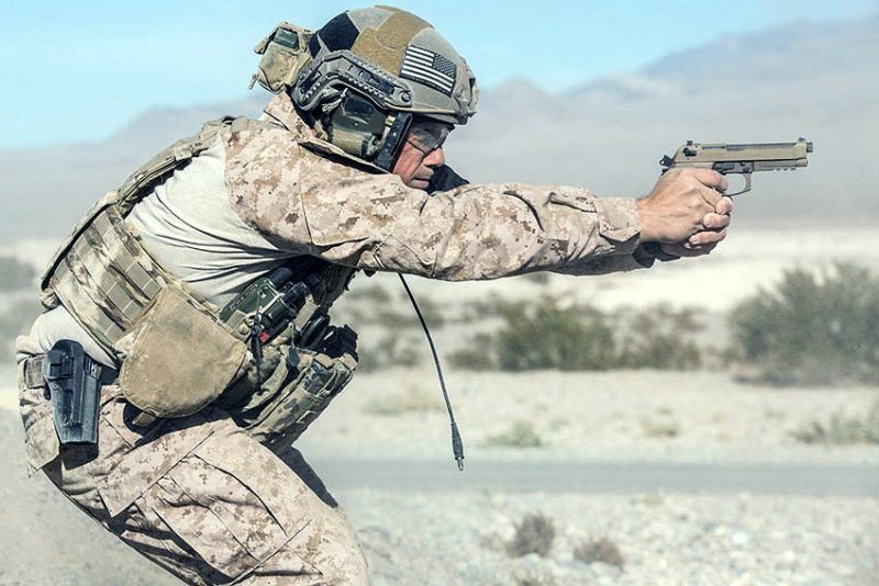 US soldier aiming with his Beretta M9A3