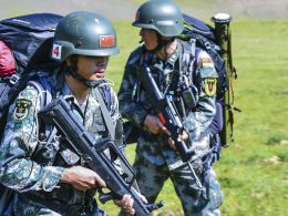 Two PLAGF soldiers with their QBZ-95s march