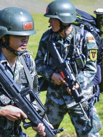 Two PLAGF soldiers with their QBZ-95s march