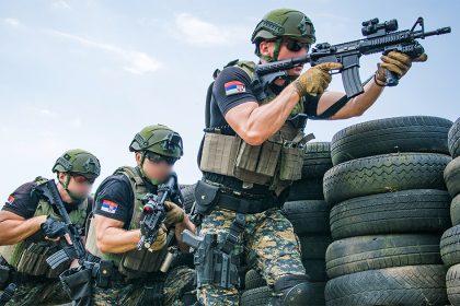 Serbian police officers armed with Colt M4 Commando rifles during training drill