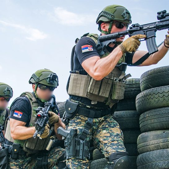 Serbian police officers armed with Colt M4 Commando rifles during training drill