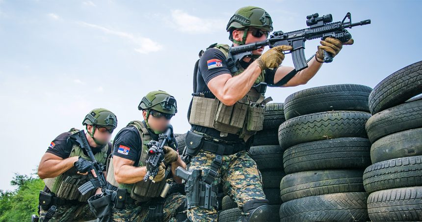 Serbian police officers armed with Colt M4 Commando rifles during training drill