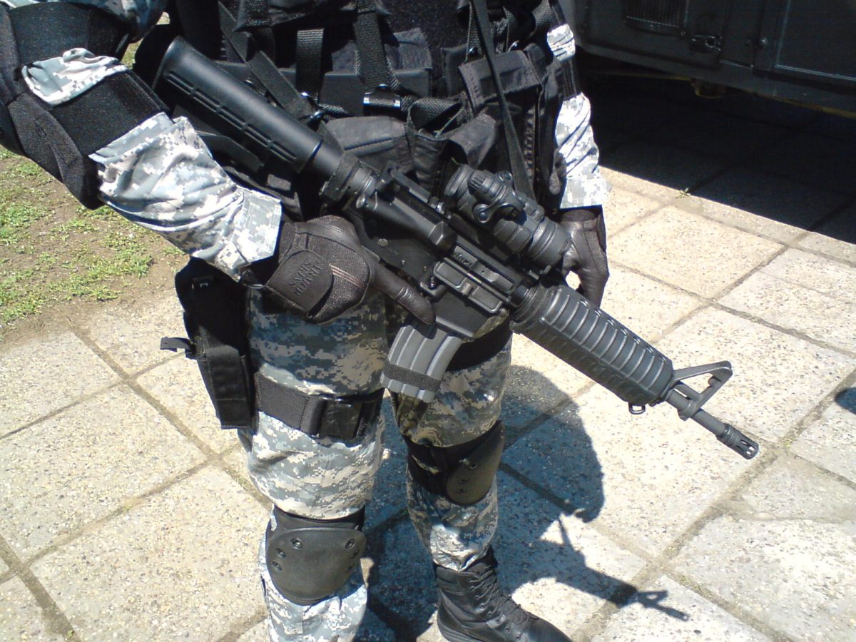 A Colt M4 Commando with an optical sight mounted on the picatinny rails