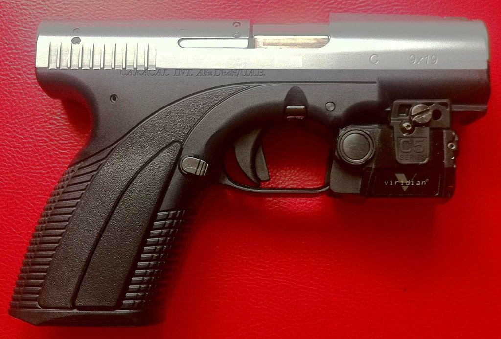 Customized two-tone Caracal C with Viridian C5L white tactical light/laser sight